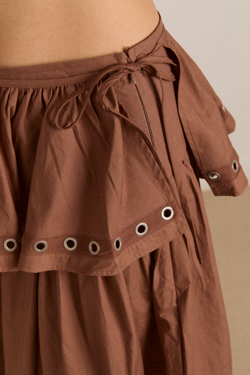anika eyelet skirt with ruffle belt- tan