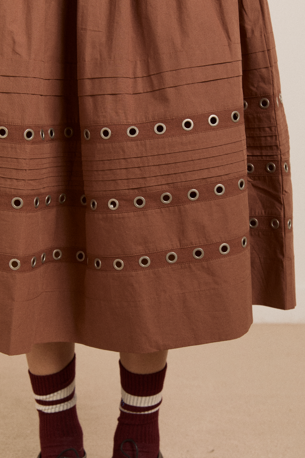 anika eyelet skirt with ruffle belt- tan