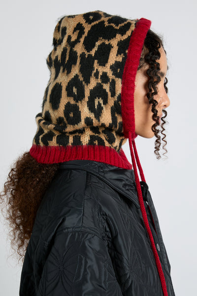 hood in leopard with red tie