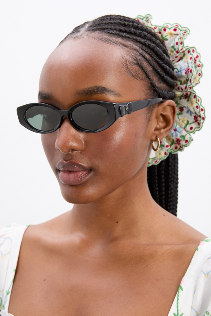 Catty Oval Sunglasses With Bow Detail In Black