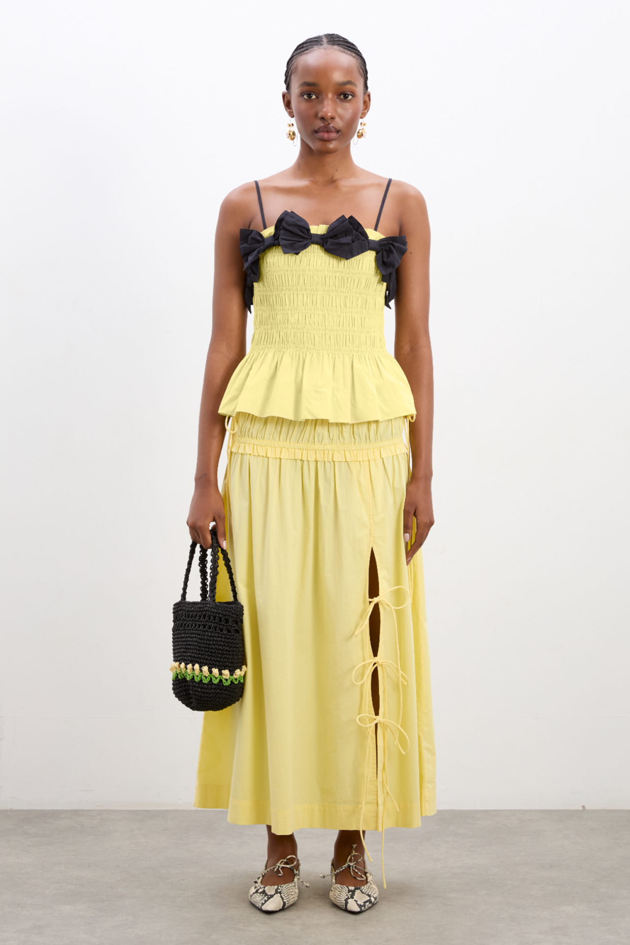 black top yellow skirt