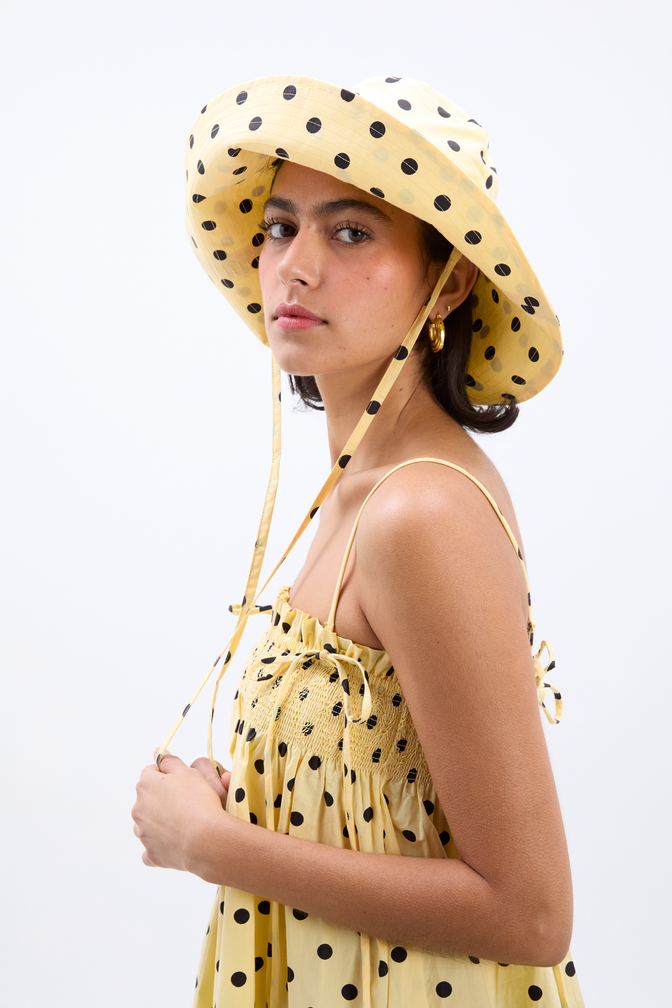 sunhat in butter yellow & black polka dot