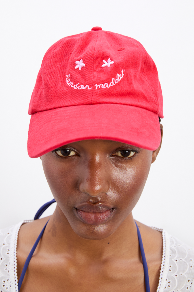 smiley cap in red with pink embroidery