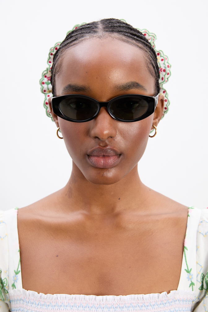 Catty Oval Sunglasses With Bow Detail In Black